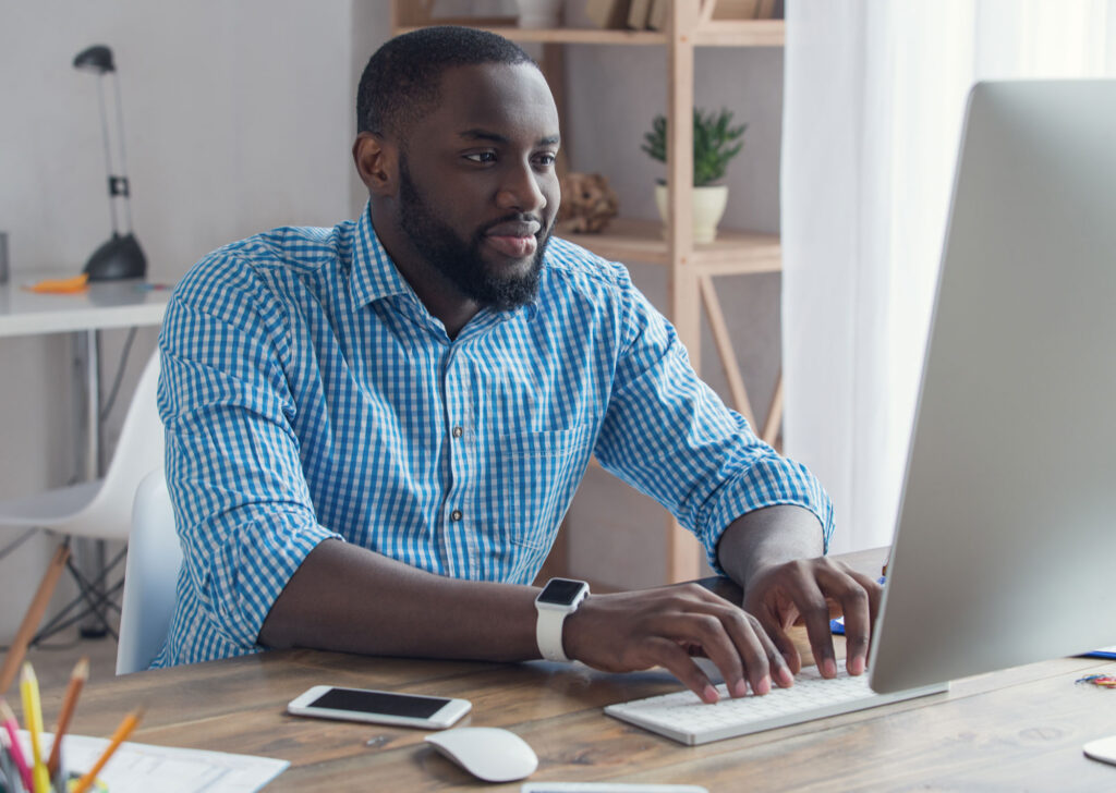 A young black man working on a website