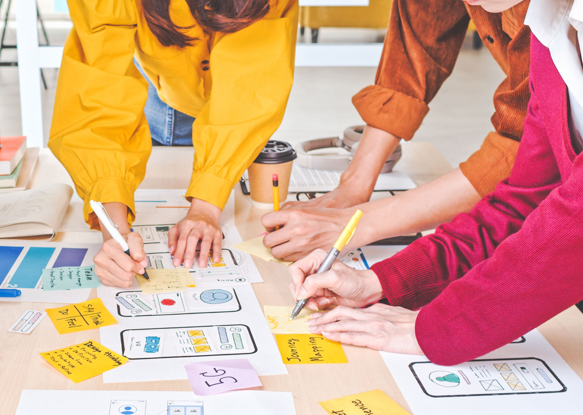 members of a creative team working on a web design project