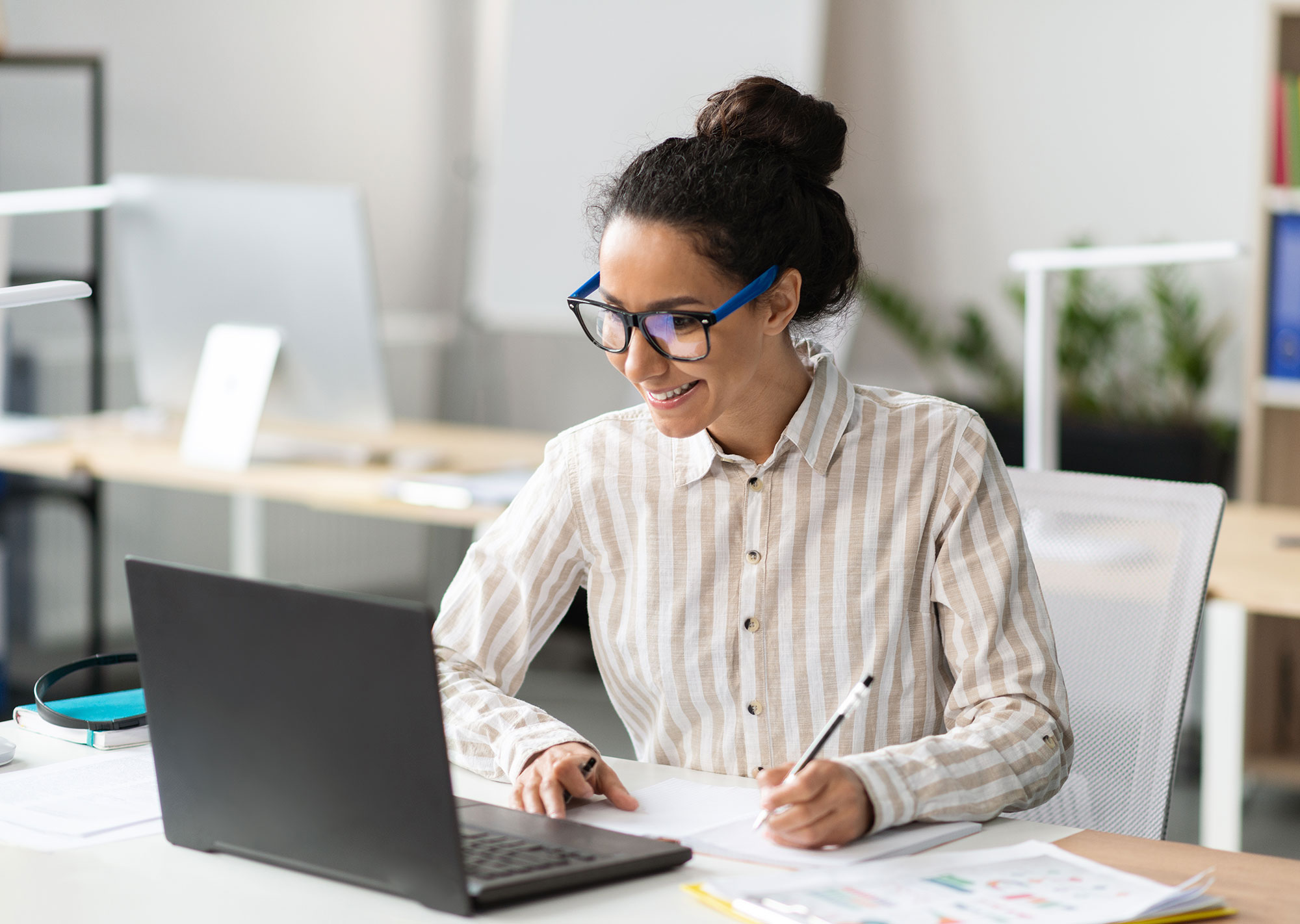 Female marketing director working on website accessibility process on computer