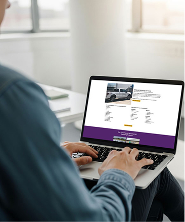 person on wildcat painting website on laptop