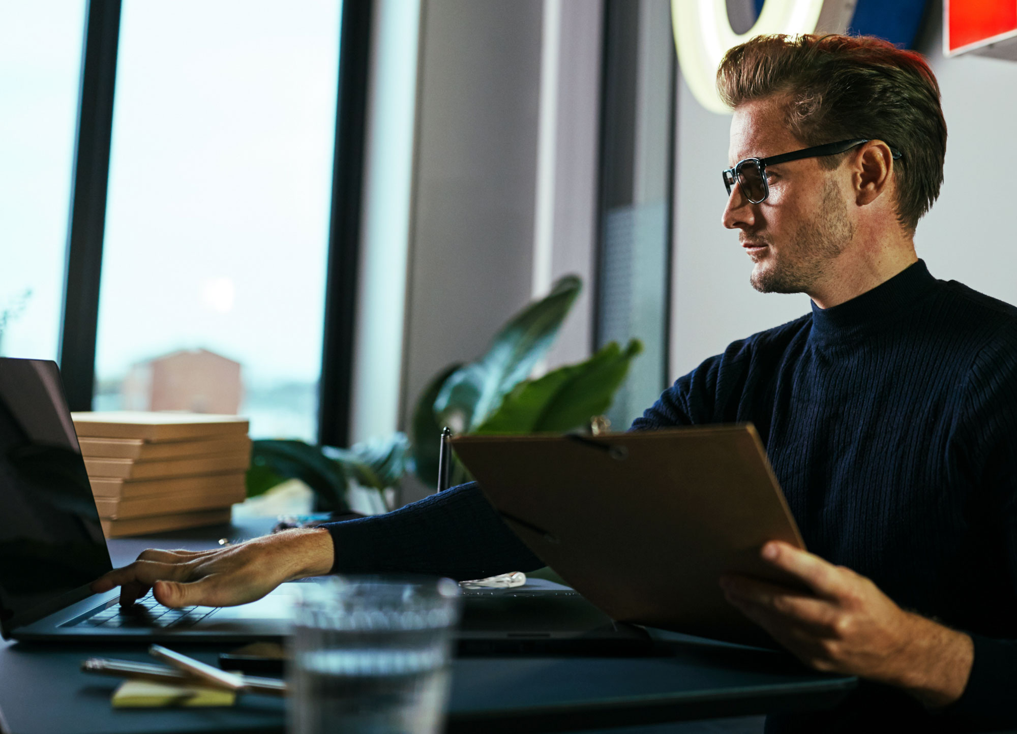 agency owner at his computer using a compliance checker