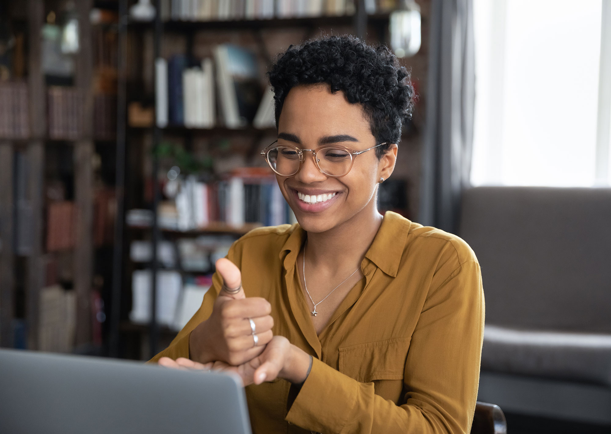 woman using sign language on video call