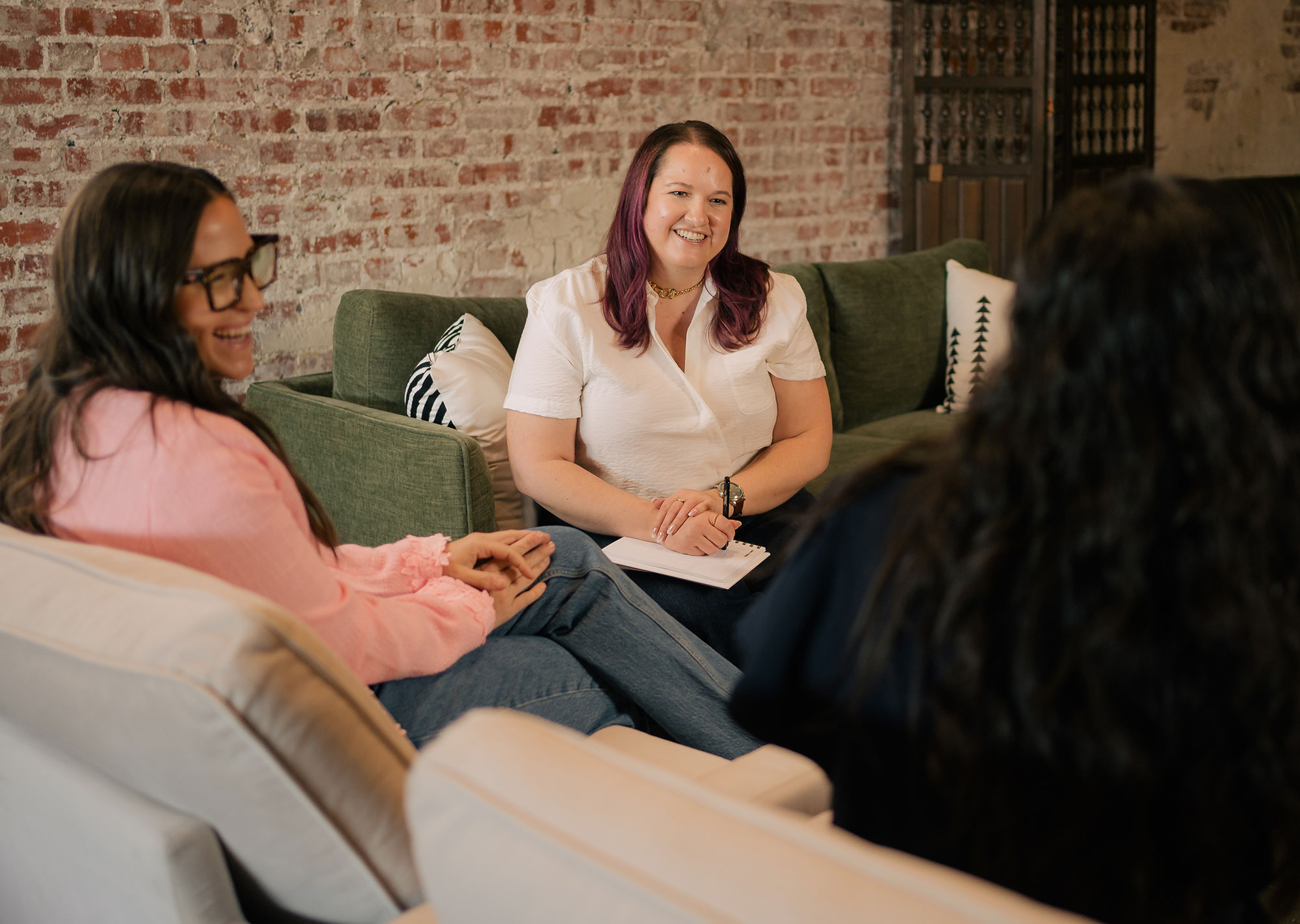 Marisa and Kalyn talking about web accessibility with a client