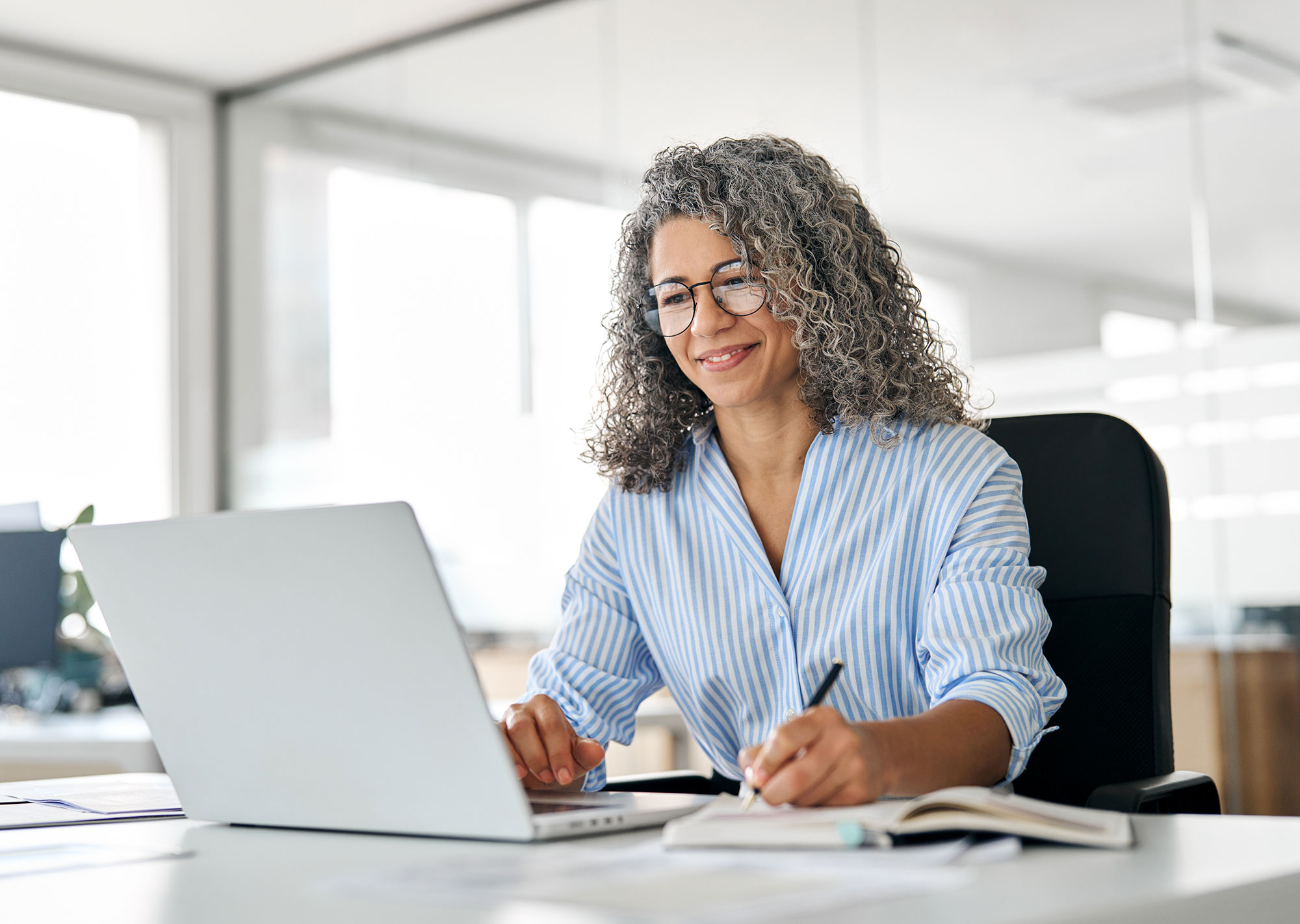 female marketing director learning web accessibility on her laptop